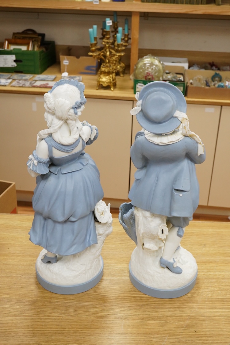 A pair of French part-bisque figures, 57cm high
